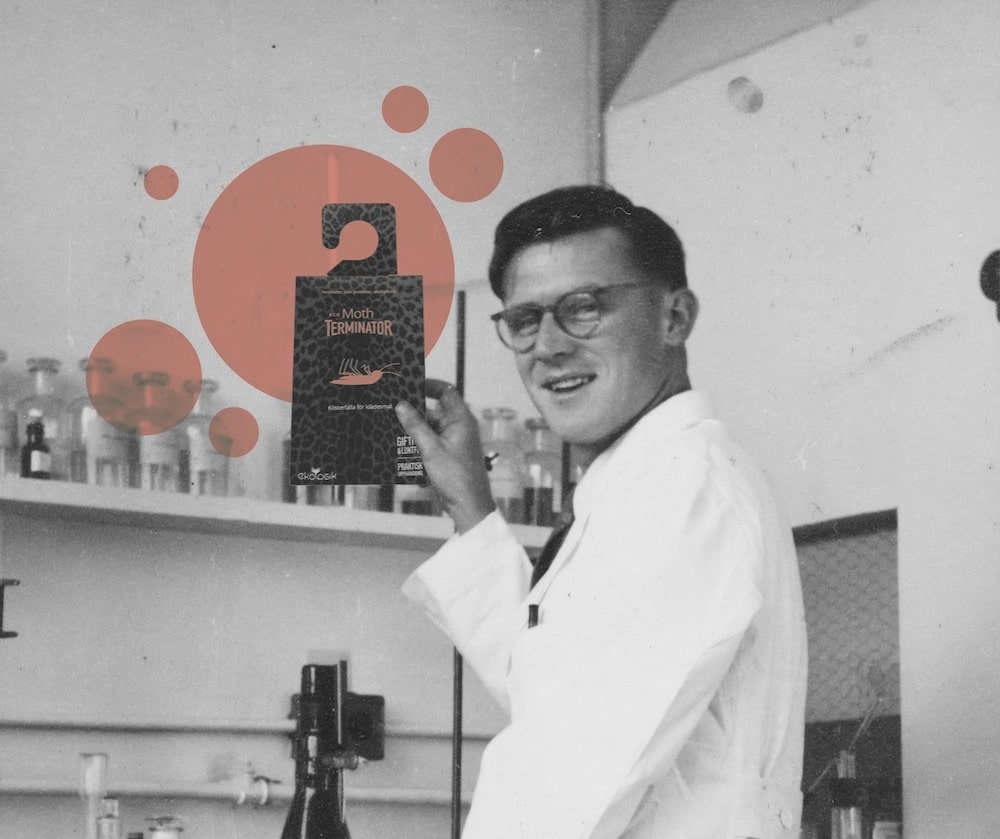 A scientist who is holding an Eco Terminator Moth Trap.